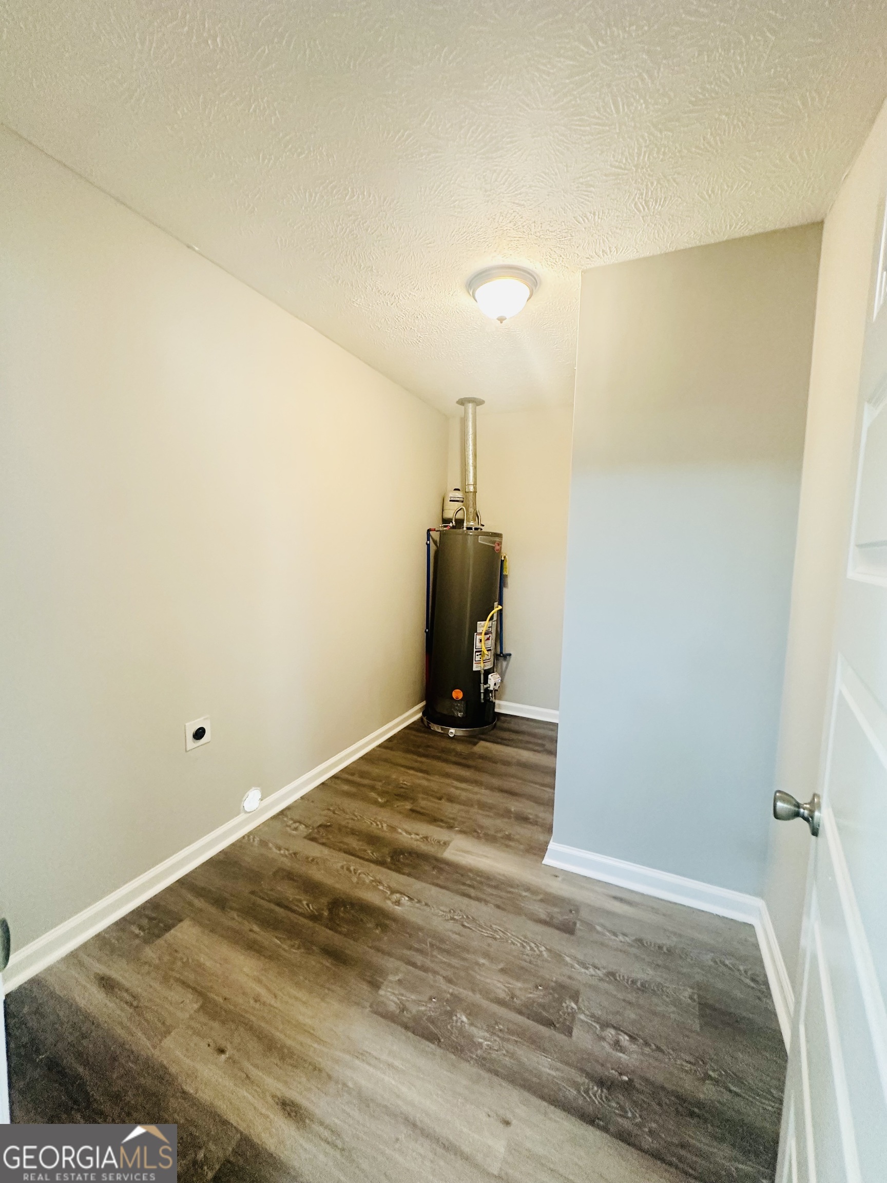 70 Darwin Drive Jonesboro, GA 30238 - Photo 11 of 19 a view of a room with wooden floor