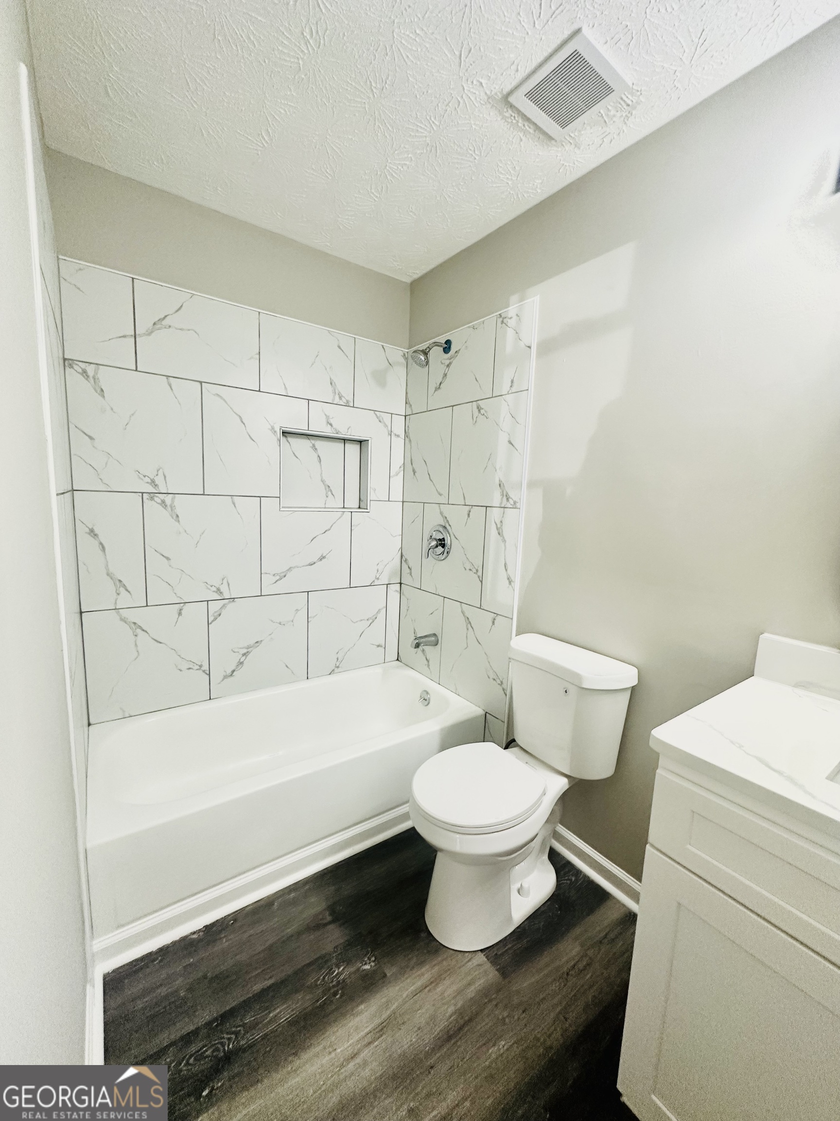 70 Darwin Drive Jonesboro, GA 30238 - Photo 15 of 19 a bathroom with a sink a toilet and a bathtub