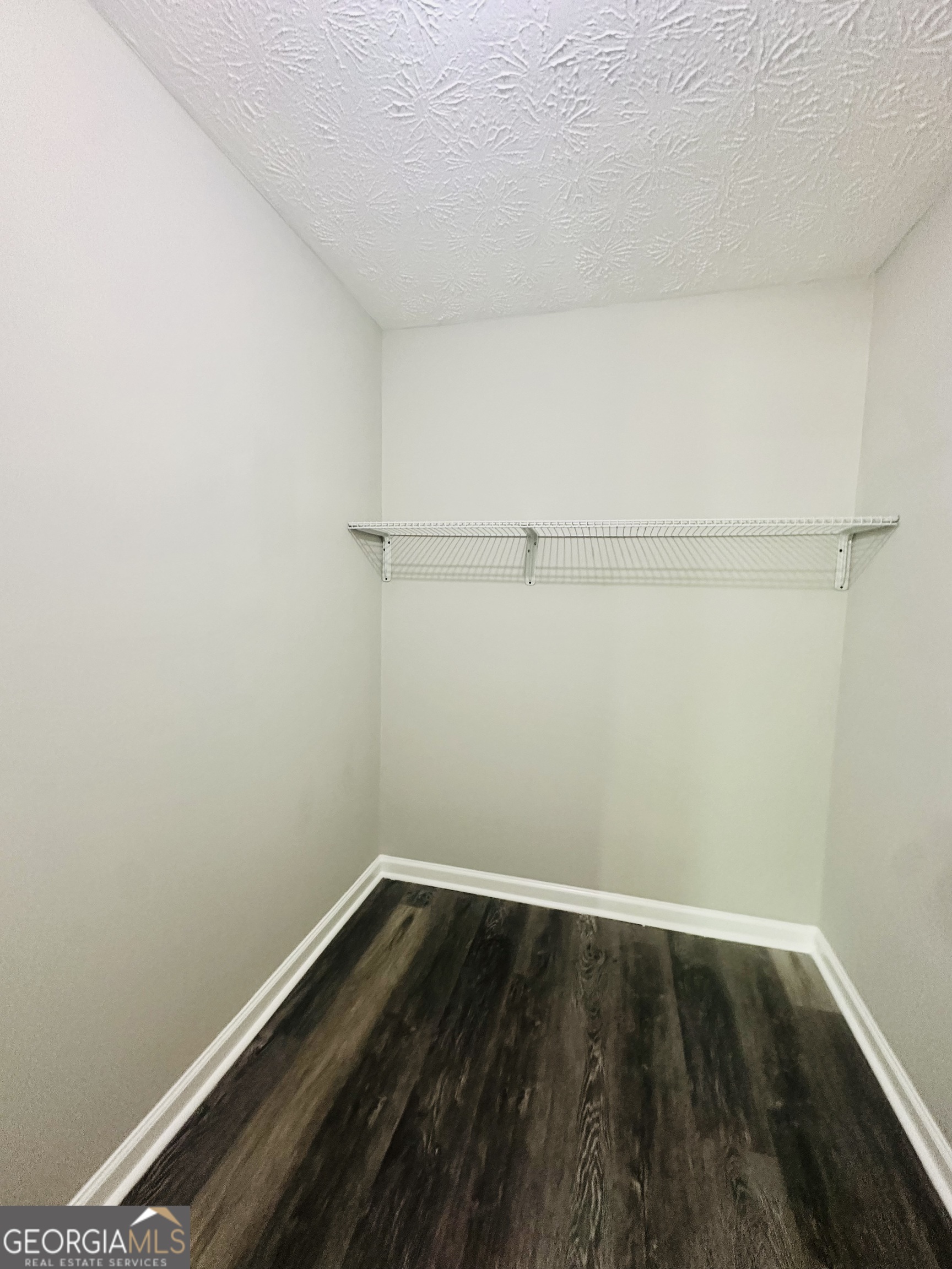 70 Darwin Drive Jonesboro, GA 30238 - Photo 16 of 19 a view of small space with racks on the wall