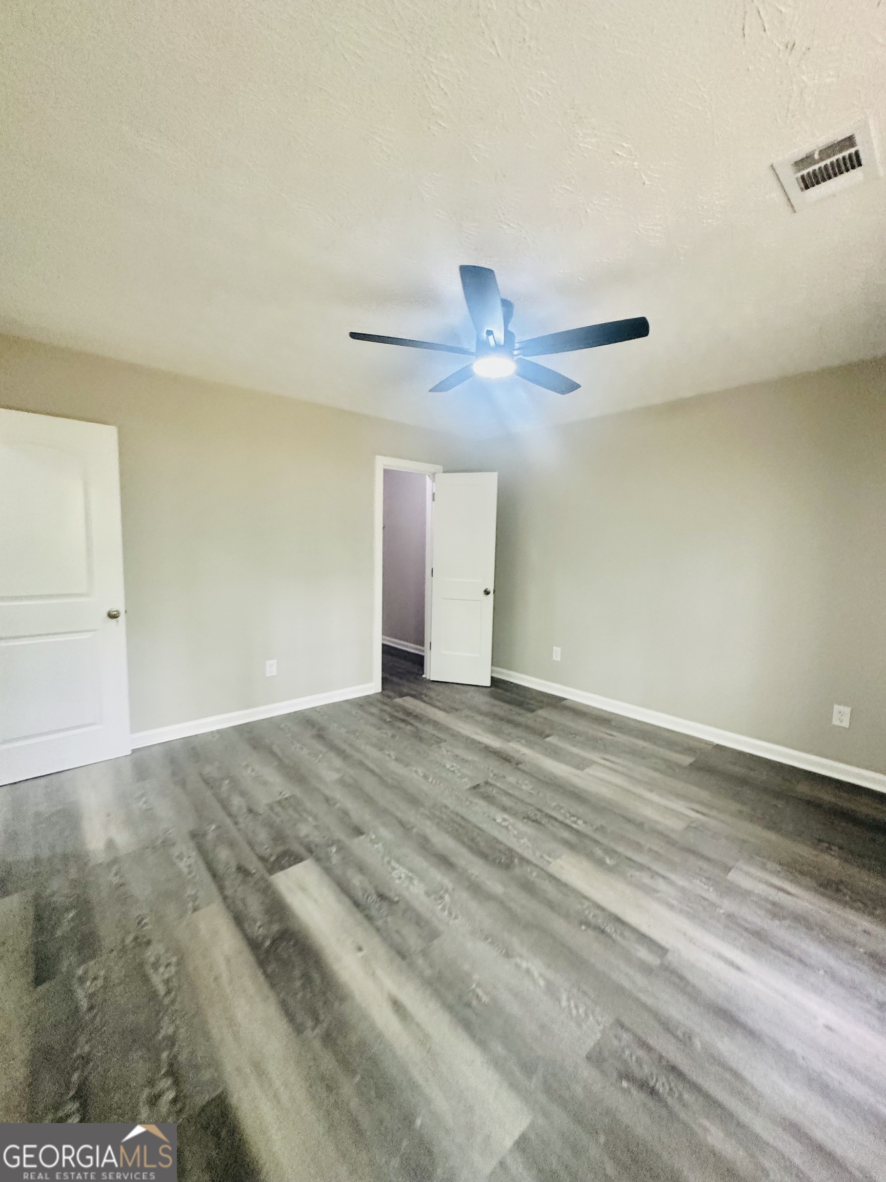 70 Darwin Drive Jonesboro, GA 30238 - Photo 17 of 19 wooden floor in an empty room