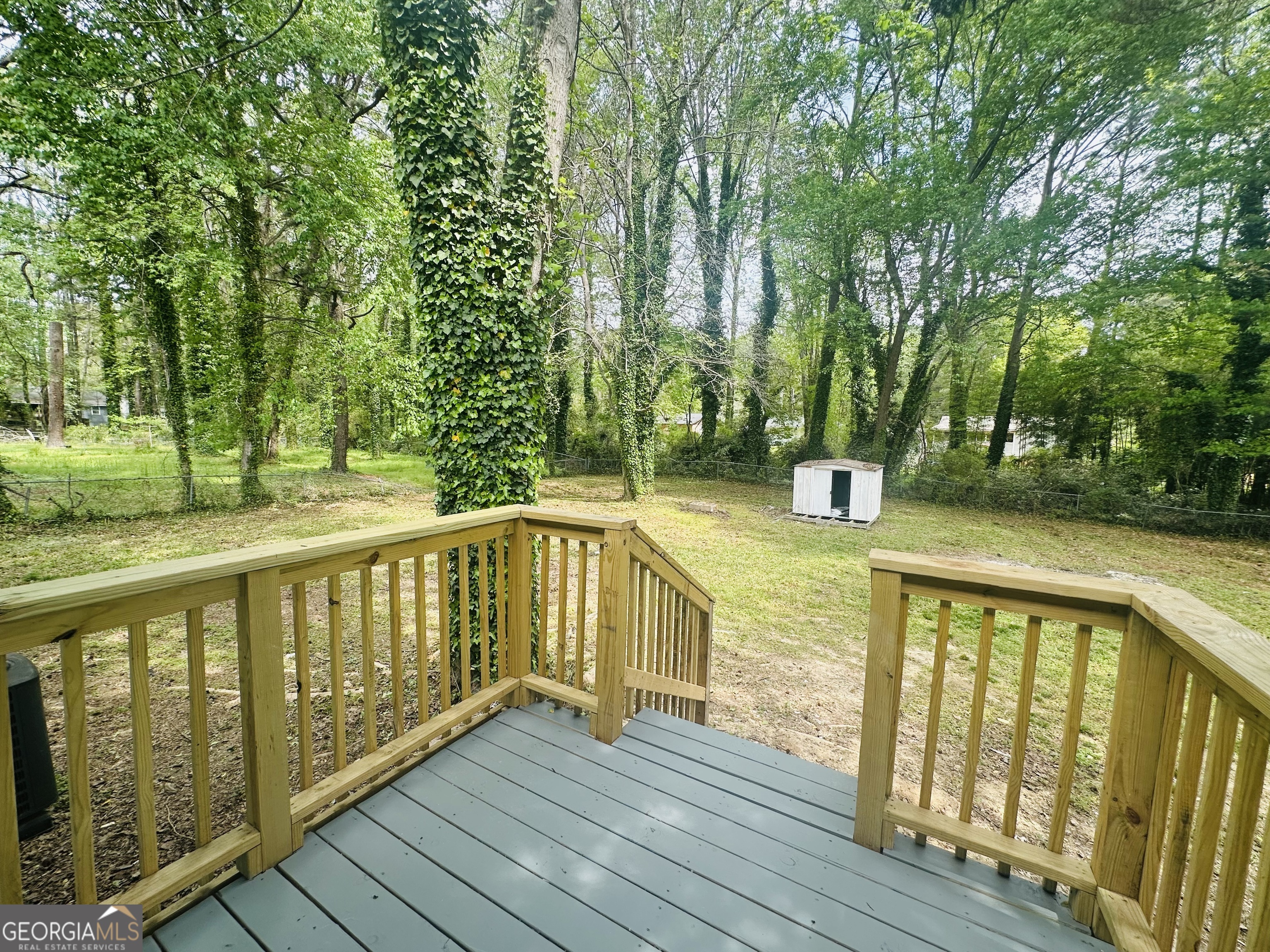70 Darwin Drive Jonesboro, GA 30238 - Photo 19 of 19 a view of balcony with wooden floor and fence