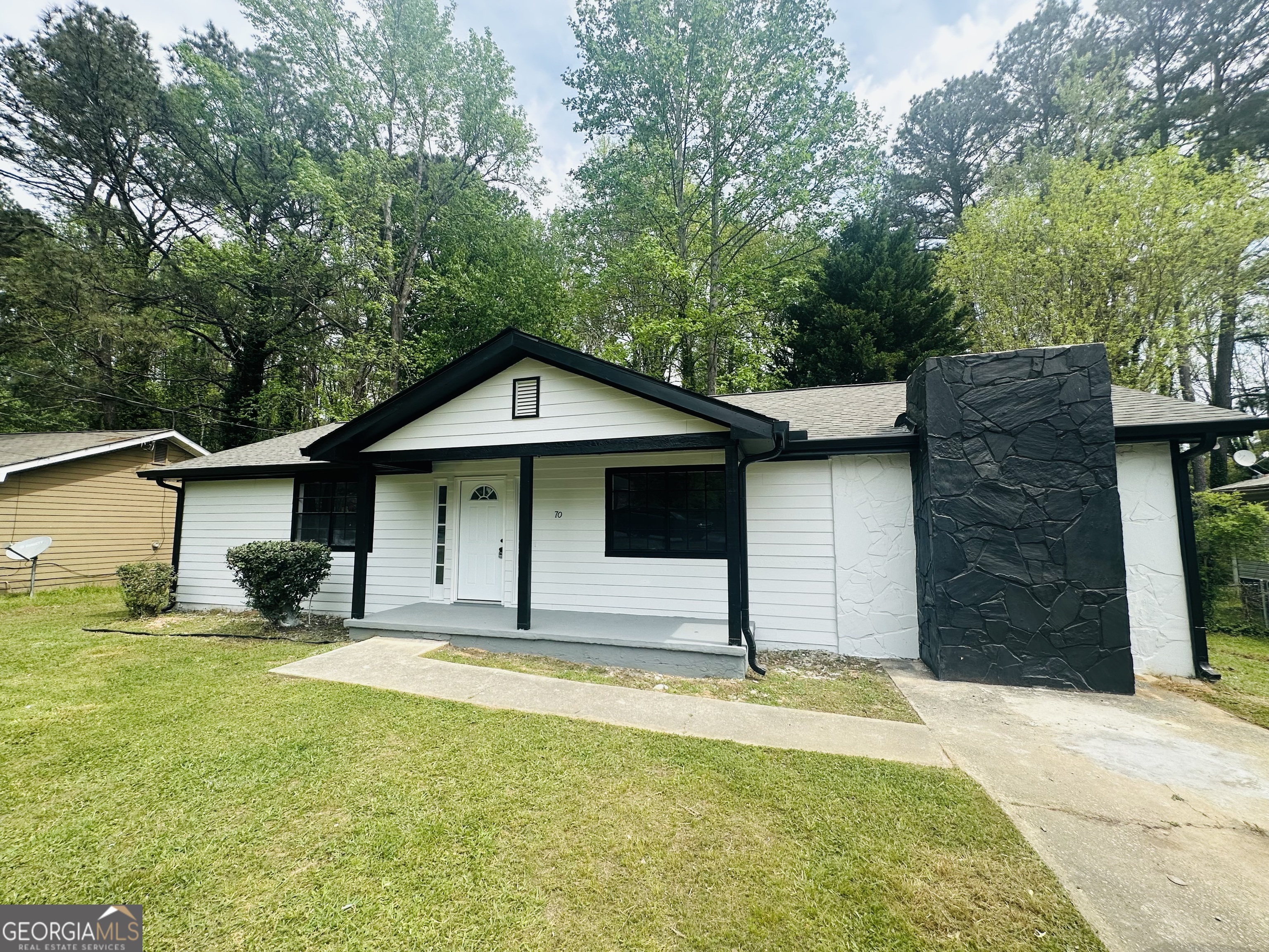 70 Darwin Drive Jonesboro, GA 30238 - Photo 2 of 19 a house with swimming pool in front of it