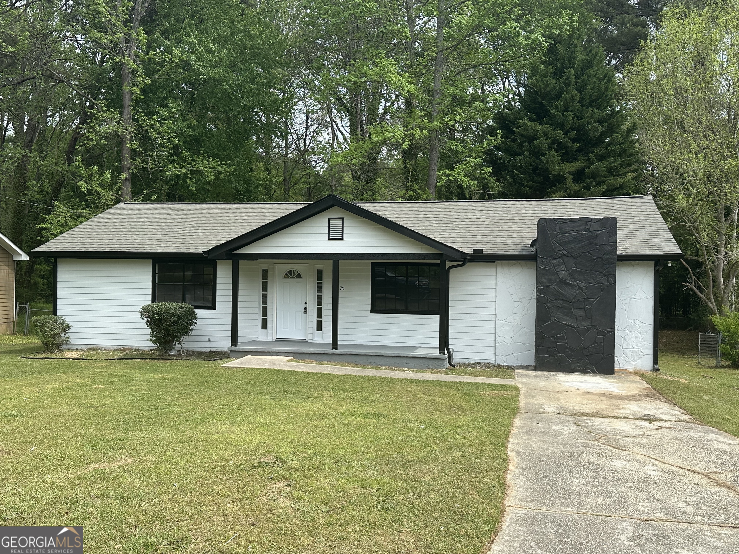 70 Darwin Drive Jonesboro, GA 30238 - Photo 3 of 19 a front view of a house with a yard