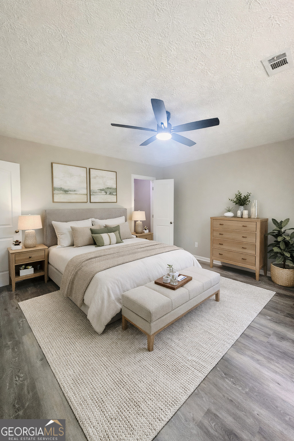 70 Darwin Drive Jonesboro, GA 30238 - Photo 5 of 19 a bedroom with a bed and ceiling fan