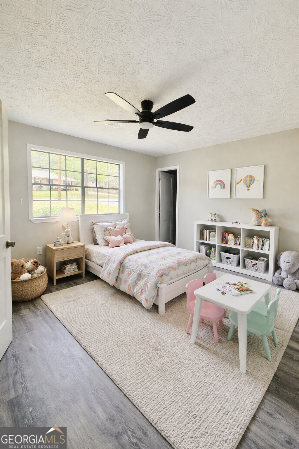 70 Darwin Drive Jonesboro, GA 30238 - Photo 6 of 19 a spacious bedroom with a bed a couch and a chandelier