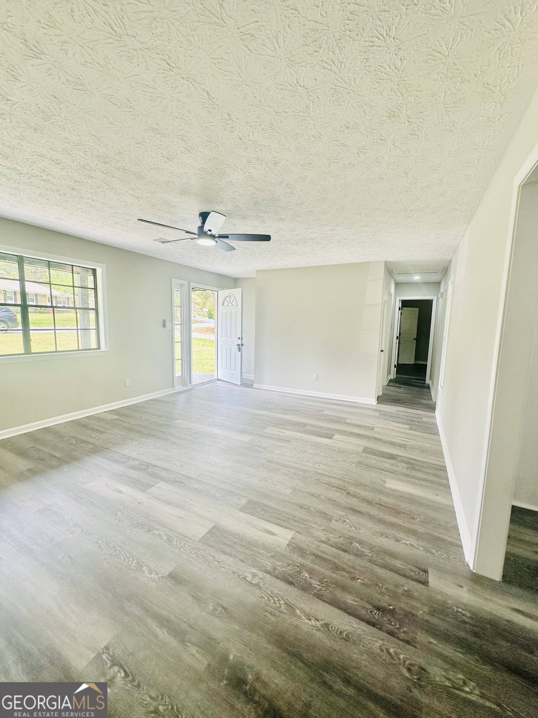 70 Darwin Drive Jonesboro, GA 30238 - Photo 7 of 19 wooden floor in an empty room