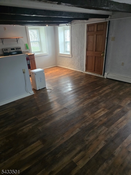 16 Musconetcong River Road, Unit 2 Hampton, NJ 08827 - Photo 4 of 12 a view of empty room with wooden floor and fan