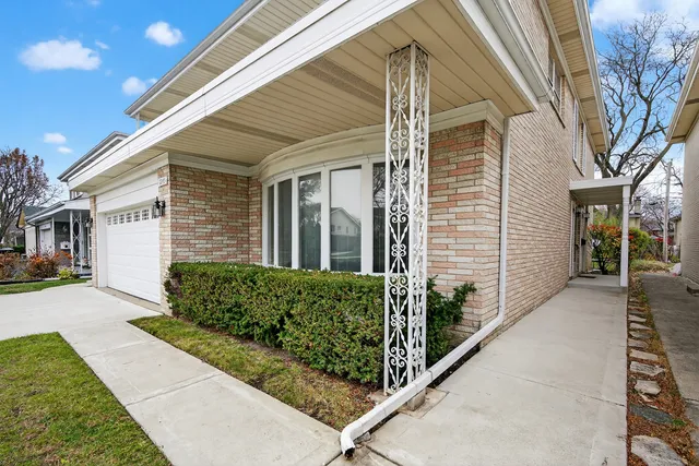 a view of a house with brick walls