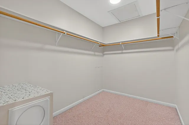 a view of storage and utility room with washer dryer