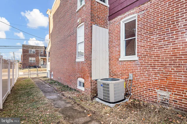 a view of a patio with chair and tables