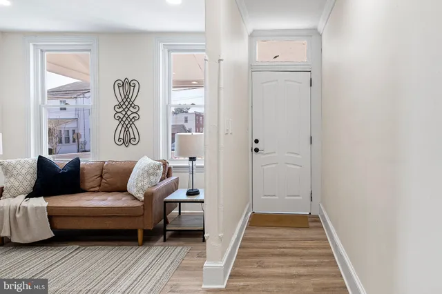a living room with furniture and a rug
