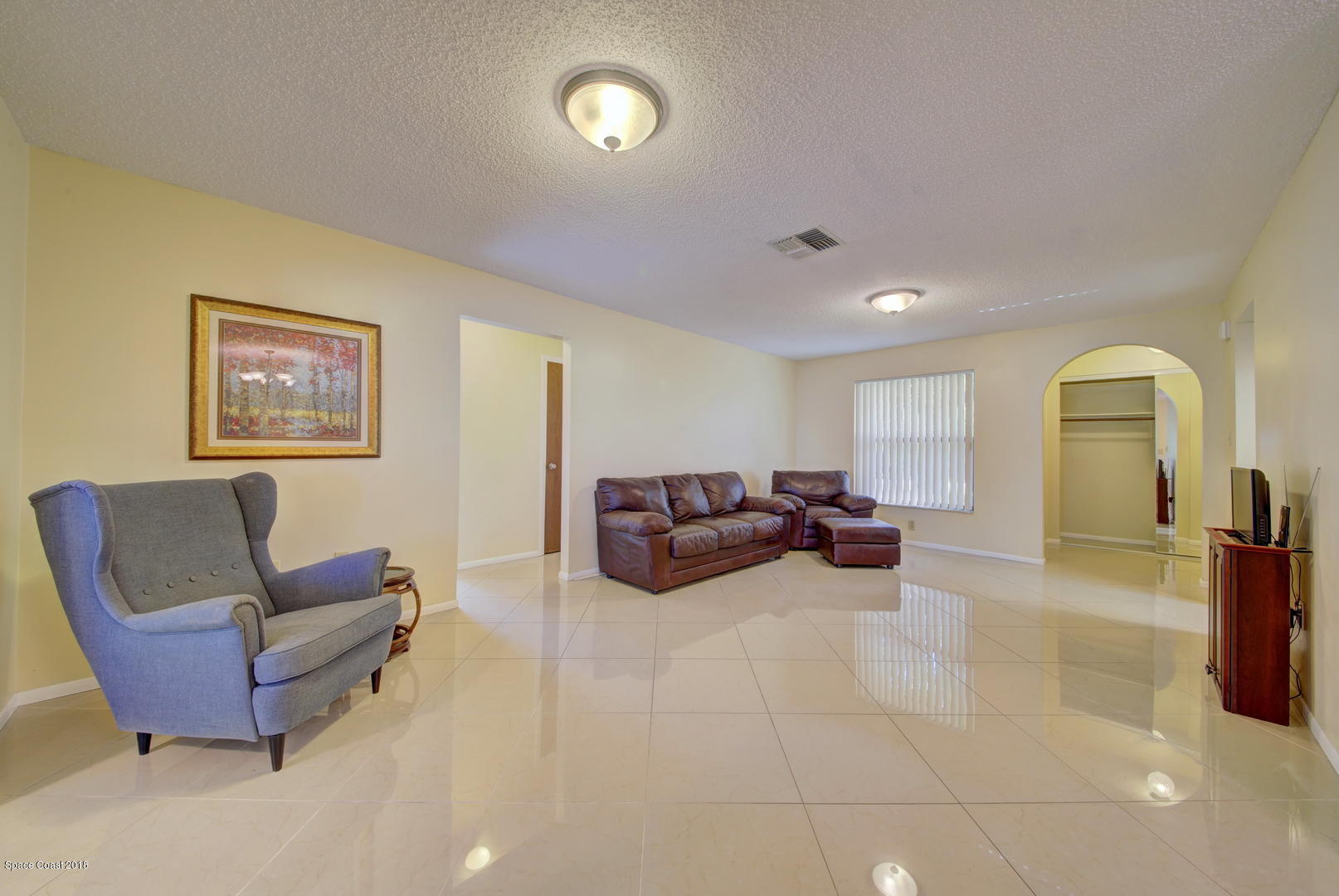 1005 Audubon Road Merritt Island, FL 32953 - Photo 15 of 39 a living room with furniture and a couch