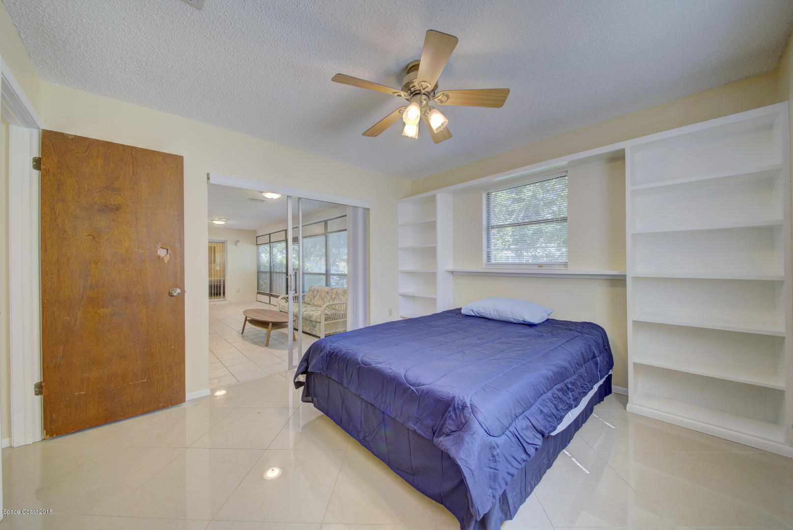1005 Audubon Road Merritt Island, FL 32953 - Photo 18 of 39 a bedroom with a bed and window