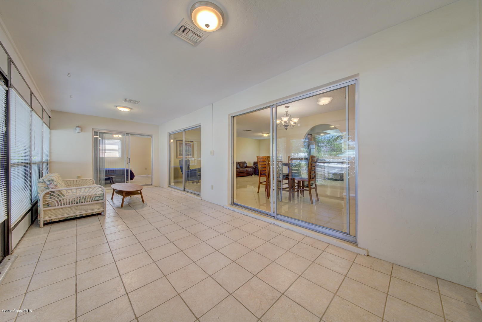 1005 Audubon Road Merritt Island, FL 32953 - Photo 20 of 39 a living room with furniture and a table