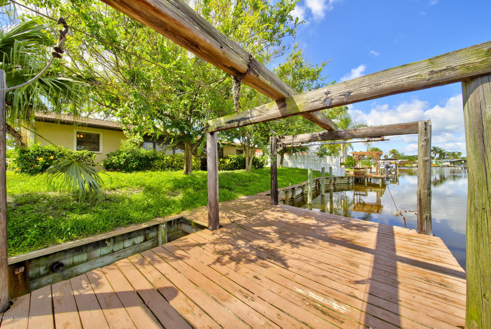 1005 Audubon Road Merritt Island, FL 32953 - Photo 37 of 39 a view of a patio with a table and chairs
