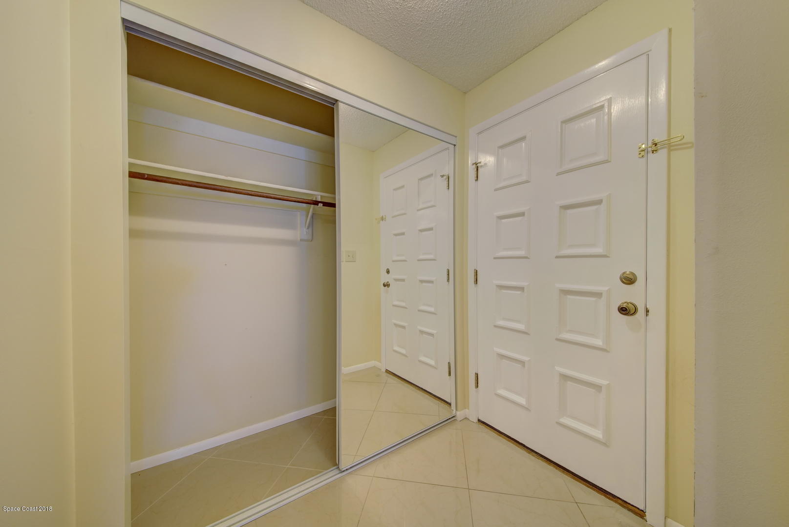 1005 Audubon Road Merritt Island, FL 32953 - Photo 5 of 39 a bathroom with a shower and a glass door