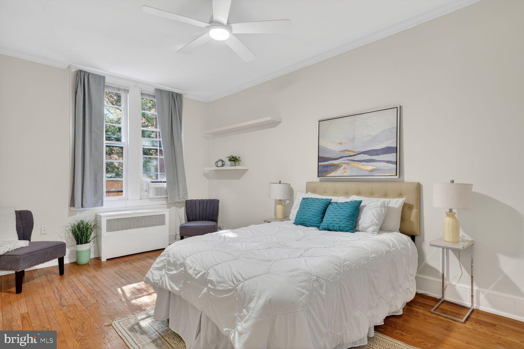 3039 Macomb Street Northwest, Unit 16 Washington, DC 20008 - Photo 12 of 17 a bedroom with a bed and wooden floor