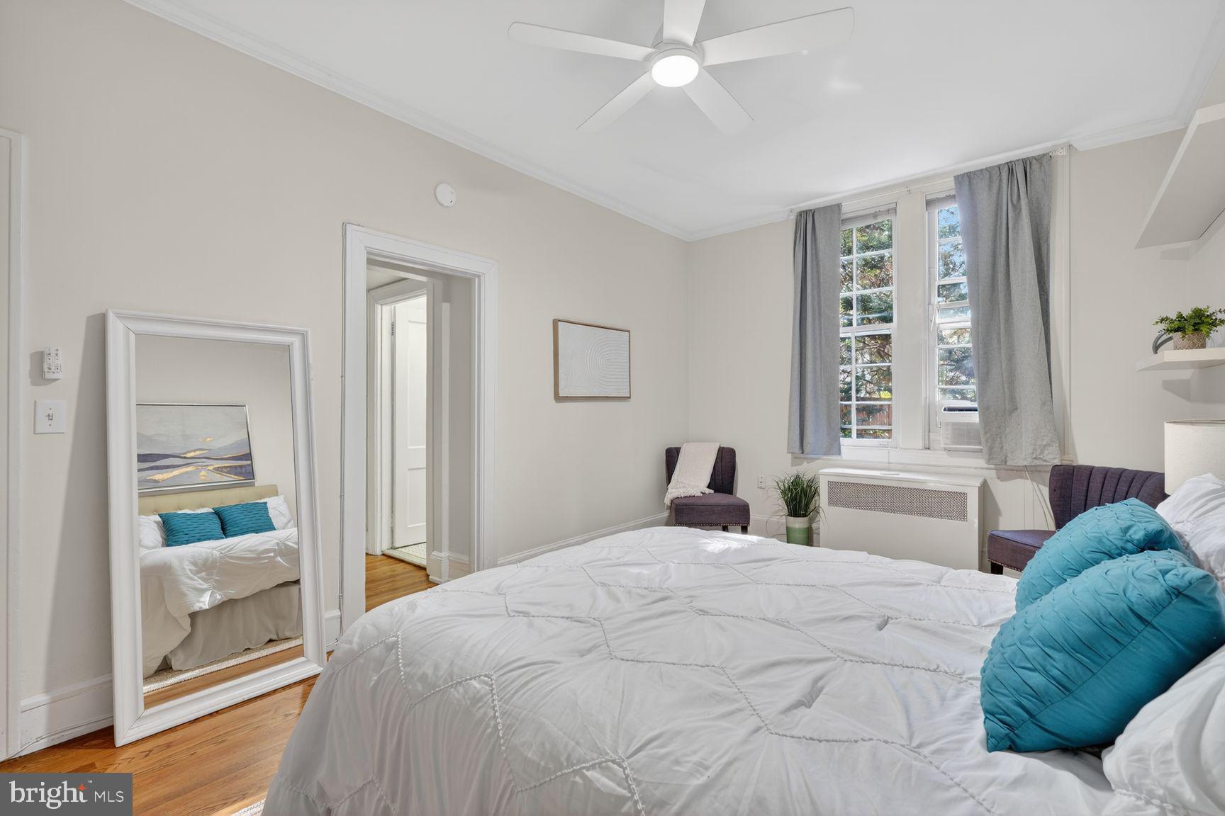 3039 Macomb Street Northwest, Unit 16 Washington, DC 20008 - Photo 13 of 17 a bedroom with a large bed and a window