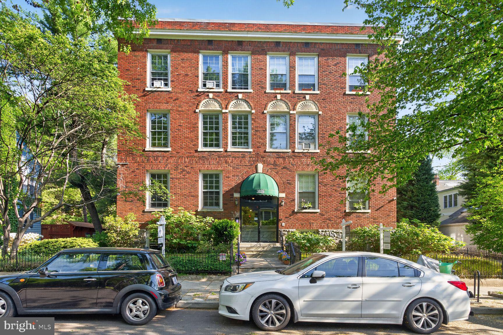 3039 Macomb Street Northwest, Unit 16 Washington, DC 20008 - Photo 17 of 17 an front view of a house with parking area