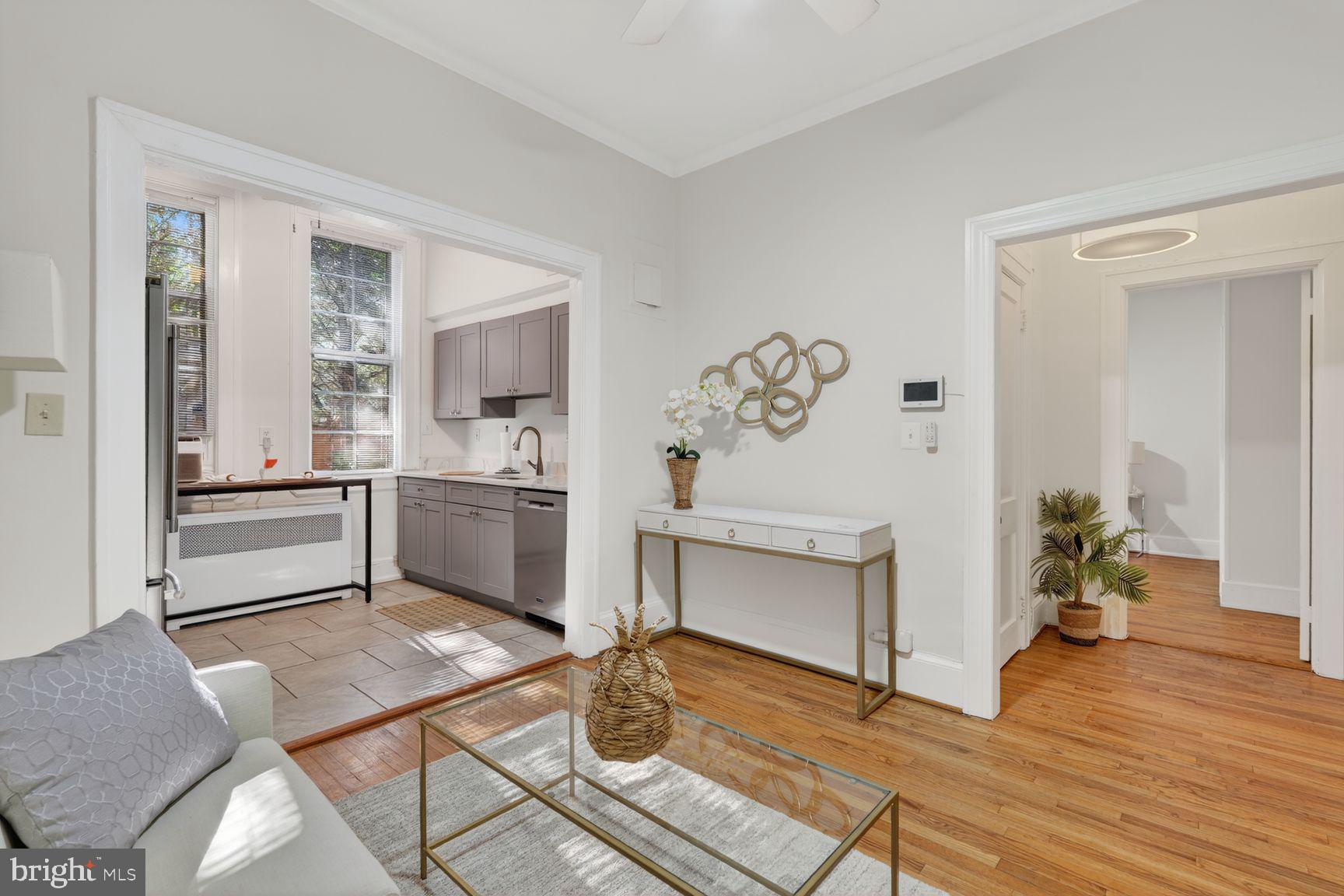 3039 Macomb Street Northwest, Unit 16 Washington, DC 20008 - Photo 5 of 17 a kitchen with a refrigerator and a stove top oven
