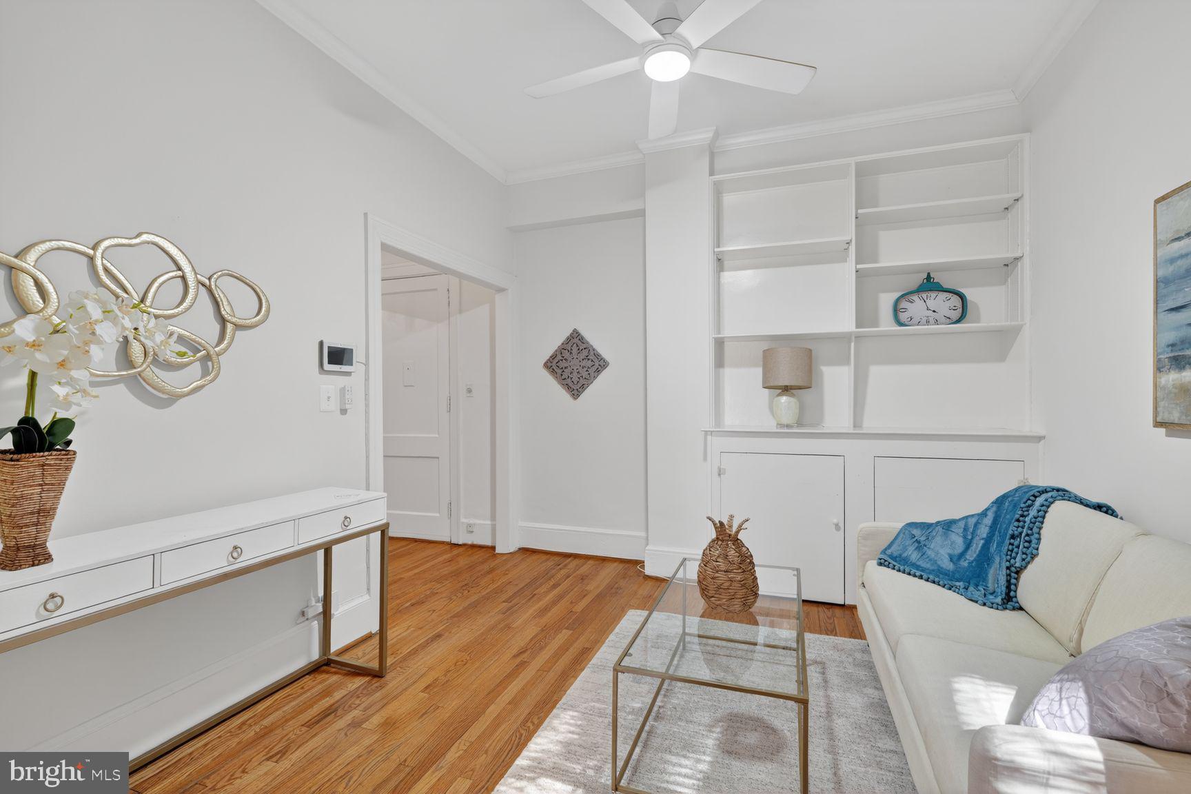 3039 Macomb Street Northwest, Unit 16 Washington, DC 20008 - Photo 6 of 17 a living room with furniture and a table