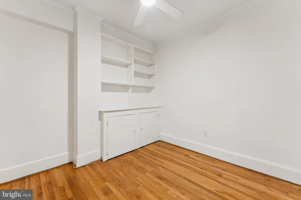 a view of a room with wooden floor