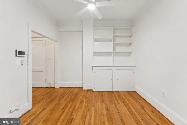 a kitchen with granite countertop a refrigerator and a stove