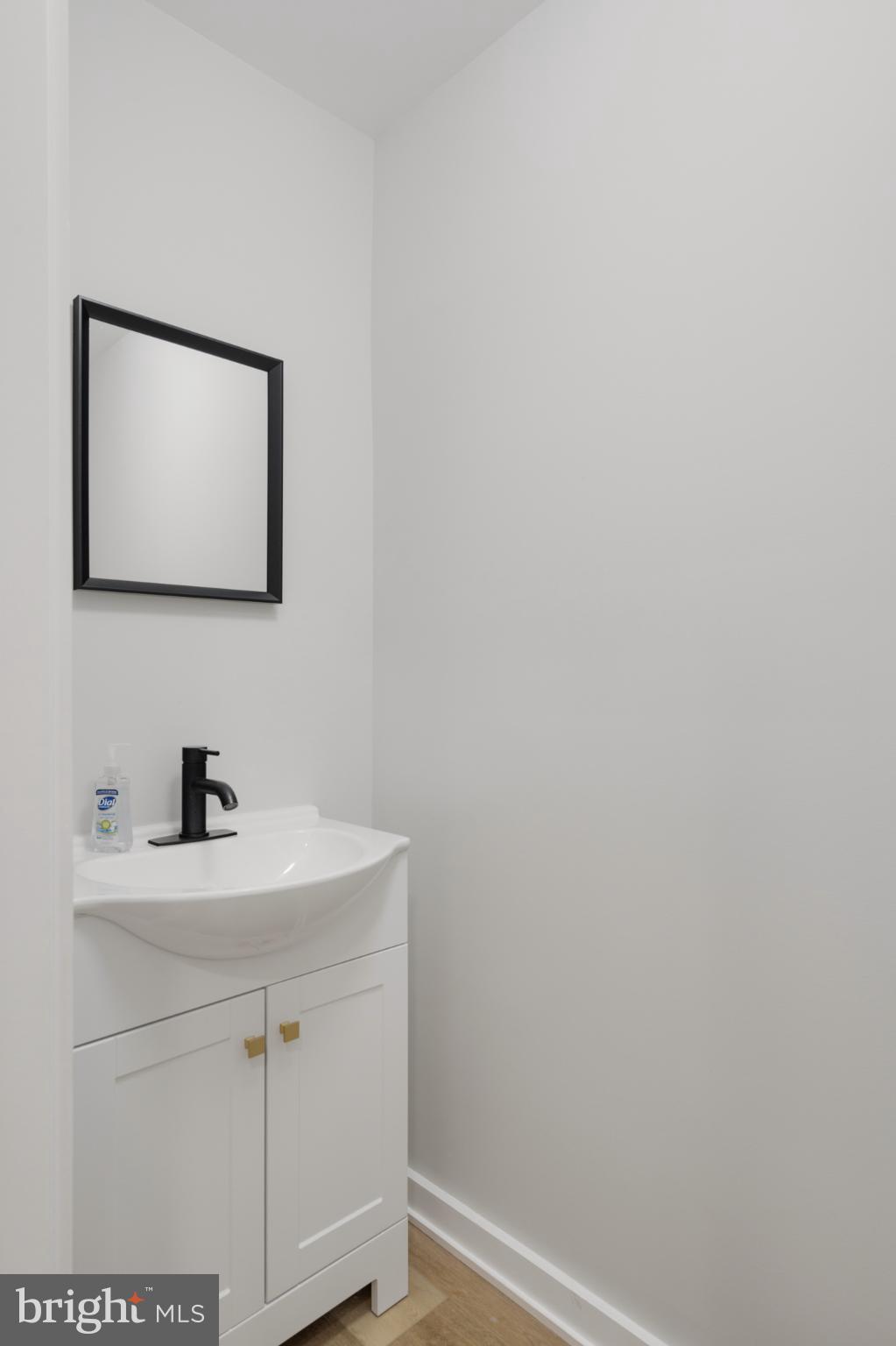 1424 North Dover Street Philadelphia, PA 19121 - Photo 11 of 23 Sleek and modern powder room design.