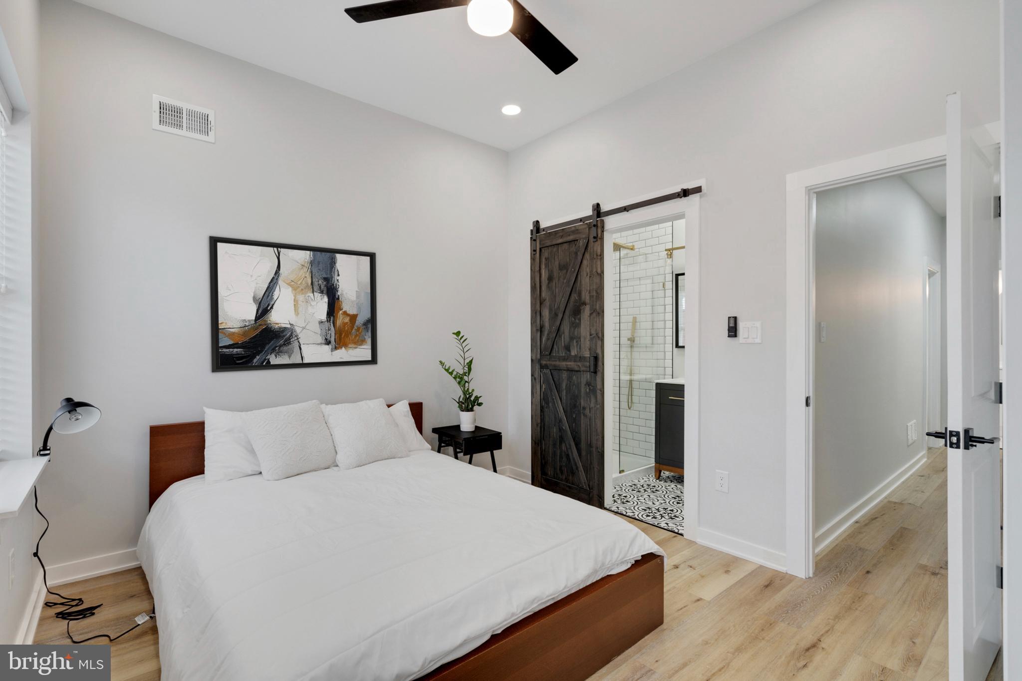 1424 North Dover Street Philadelphia, PA 19121 - Photo 12 of 23 Modern bedroom with stylish barn door.
