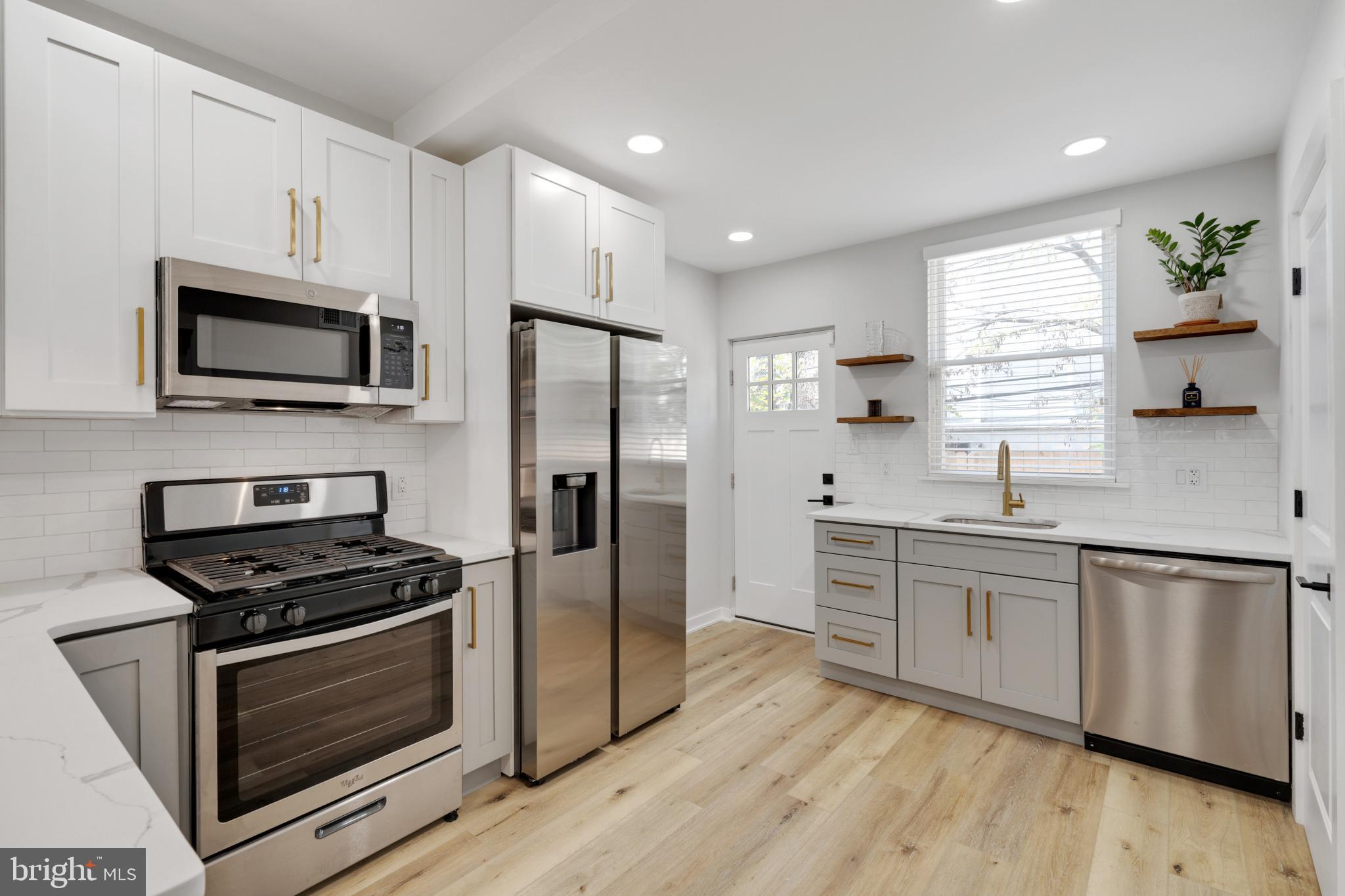 1424 North Dover Street Philadelphia, PA 19121 - Photo 6 of 23 Modern kitchen with sleek finishes.