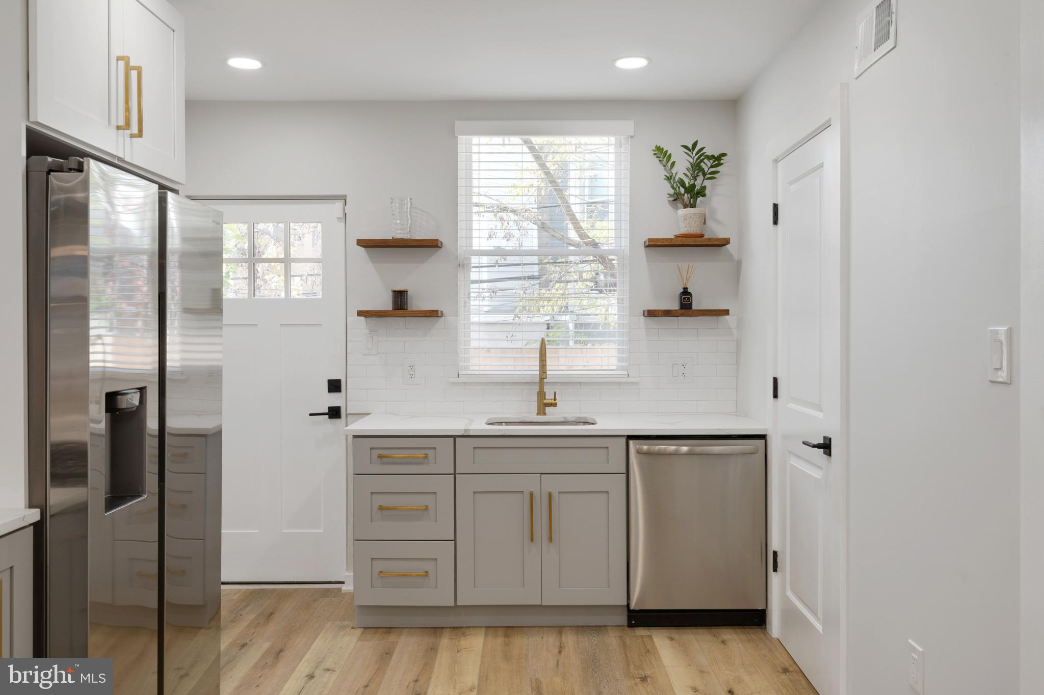 1424 North Dover Street Philadelphia, PA 19121 - Photo 7 of 23 Modern kitchen with sleek finishes.