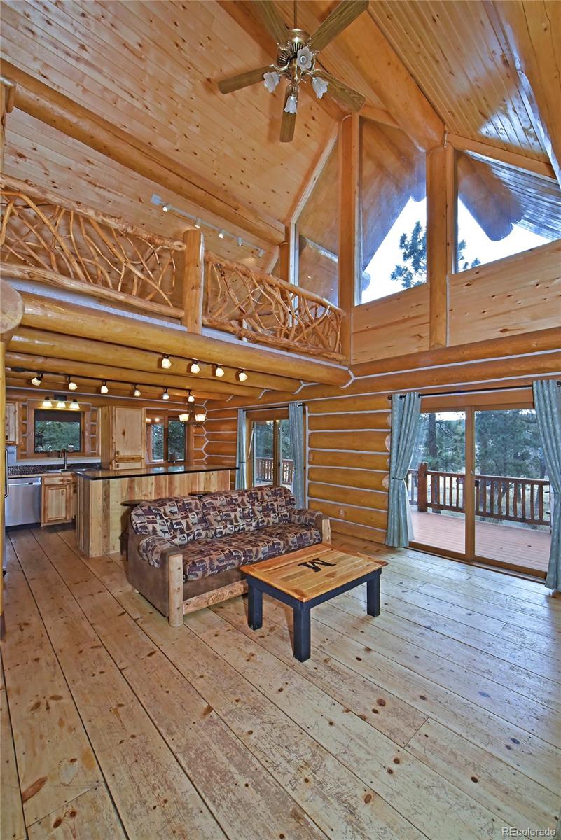 79 Buggy Whip Road Bailey, CO 80421 - Photo 20 of 39 a view of a chairs and a table in the patio