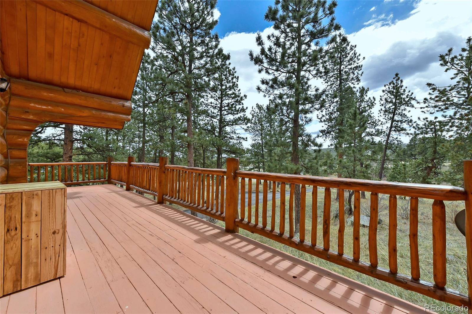 79 Buggy Whip Road Bailey, CO 80421 - Photo 3 of 39 a view of balcony with wooden floor and outdoor seating