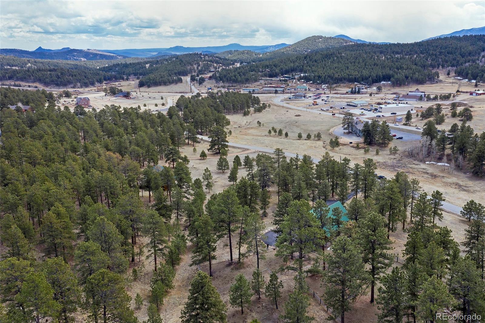 79 Buggy Whip Road Bailey, CO 80421 - Photo 39 of 39 an aerial view of mountain with residential house and green space