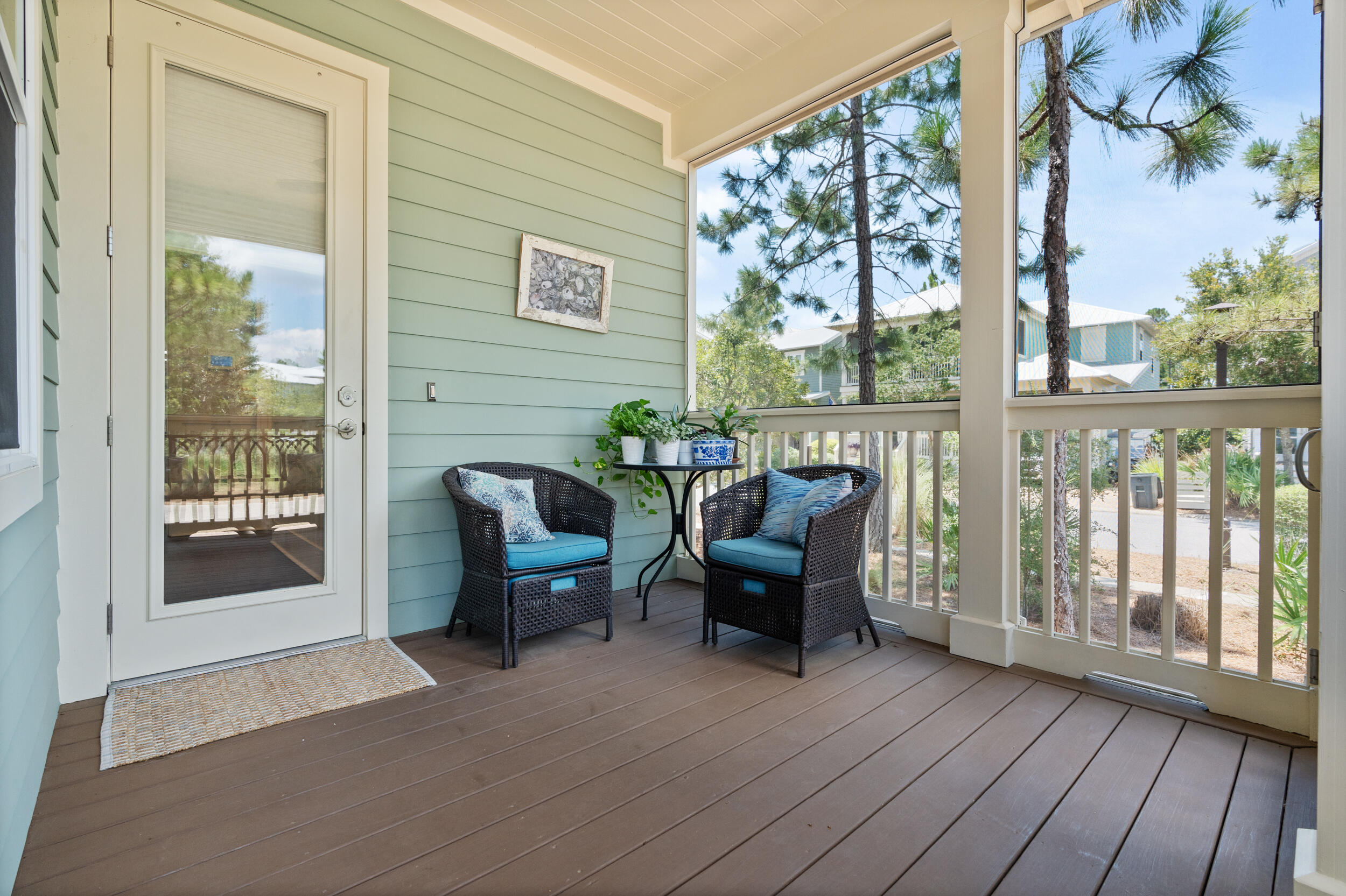 694 Flatwoods Forest Loop Santa Rosa Beach, FL 32459 - Photo 17 of 50 a balcony with furniture and wooden floor