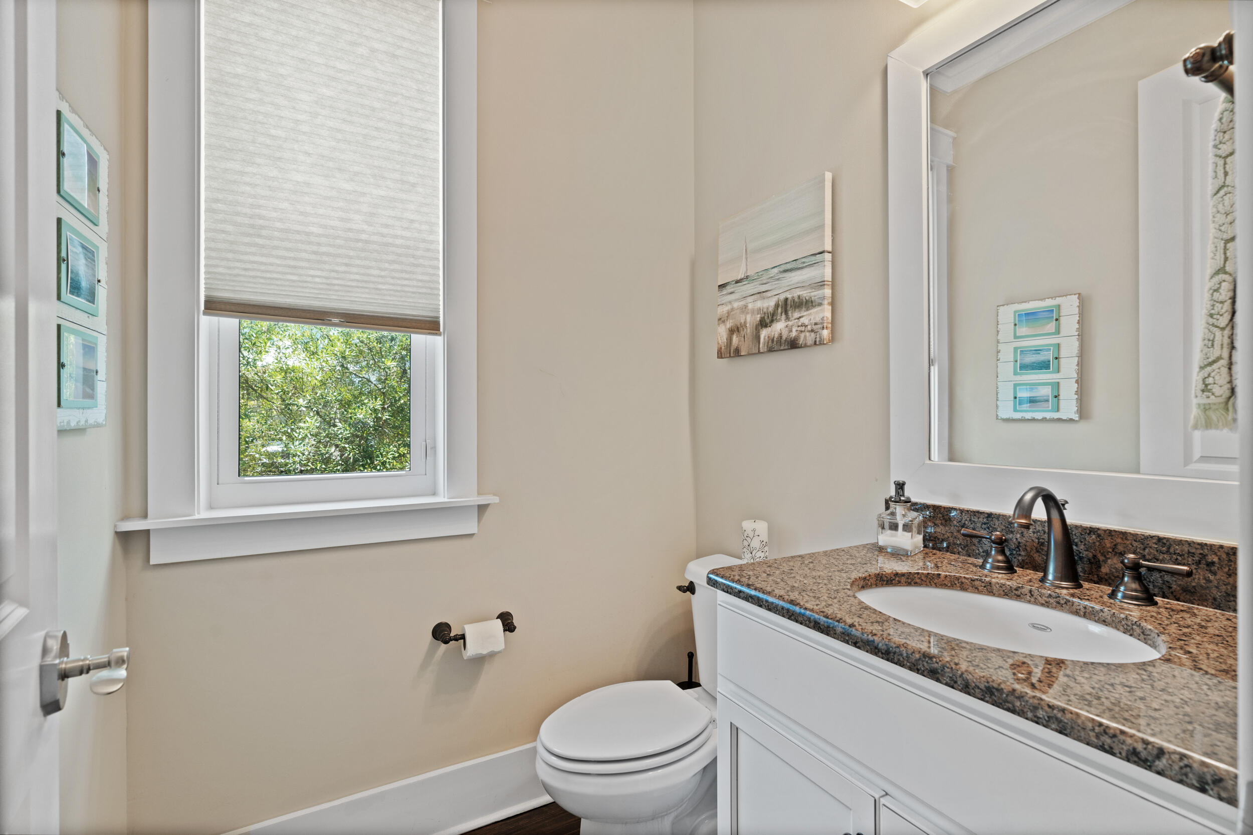 694 Flatwoods Forest Loop Santa Rosa Beach, FL 32459 - Photo 20 of 50 a bathroom with a granite countertop sink a toilet and a mirror