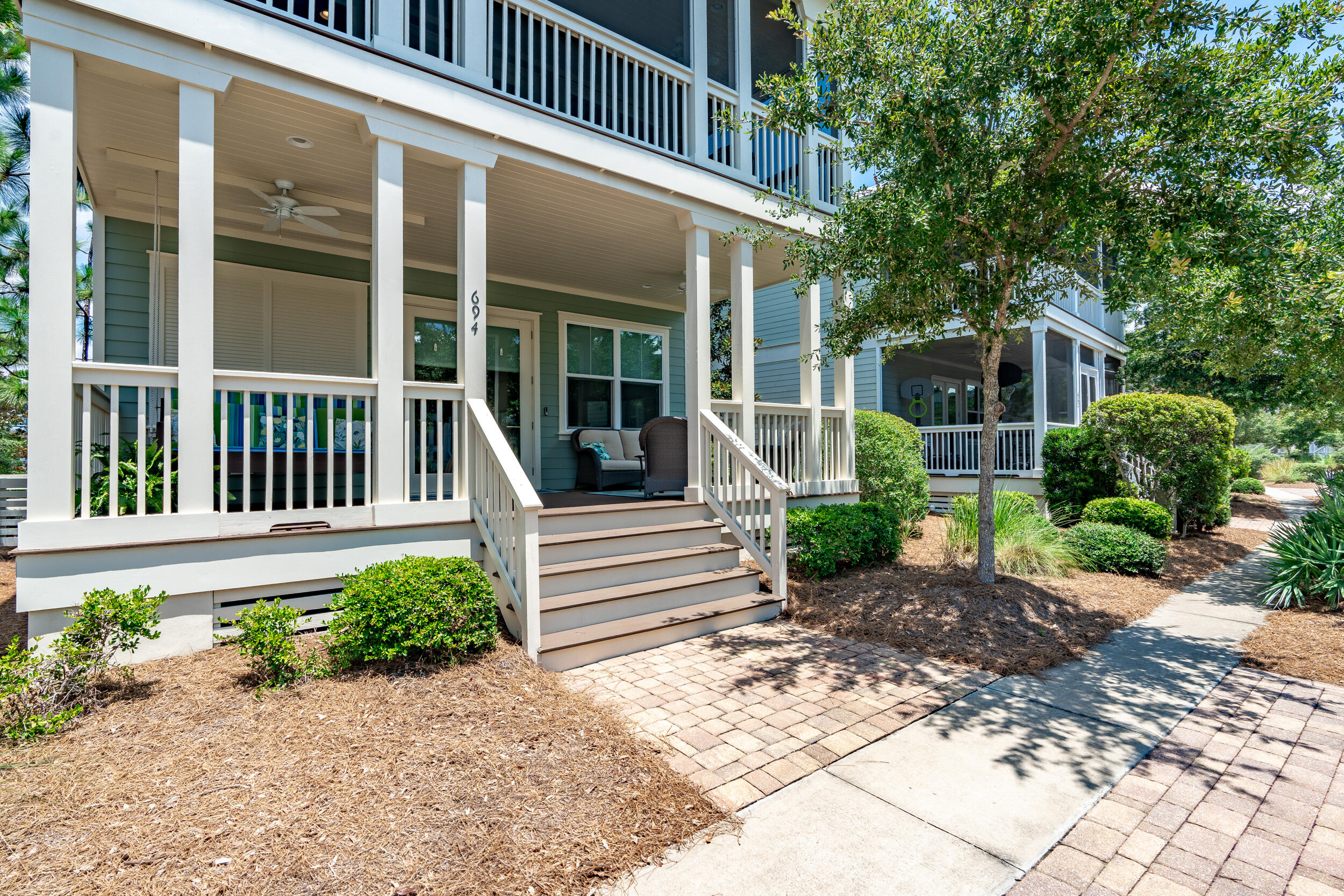 694 Flatwoods Forest Loop Santa Rosa Beach, FL 32459 - Photo 2 of 50 a view of a house with a yard and plants