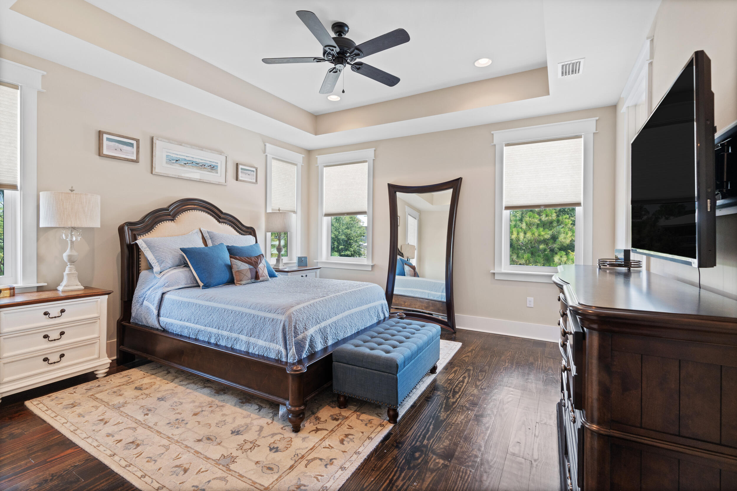 694 Flatwoods Forest Loop Santa Rosa Beach, FL 32459 - Photo 27 of 50 a living room with a bed furniture flat screen tv and a large window