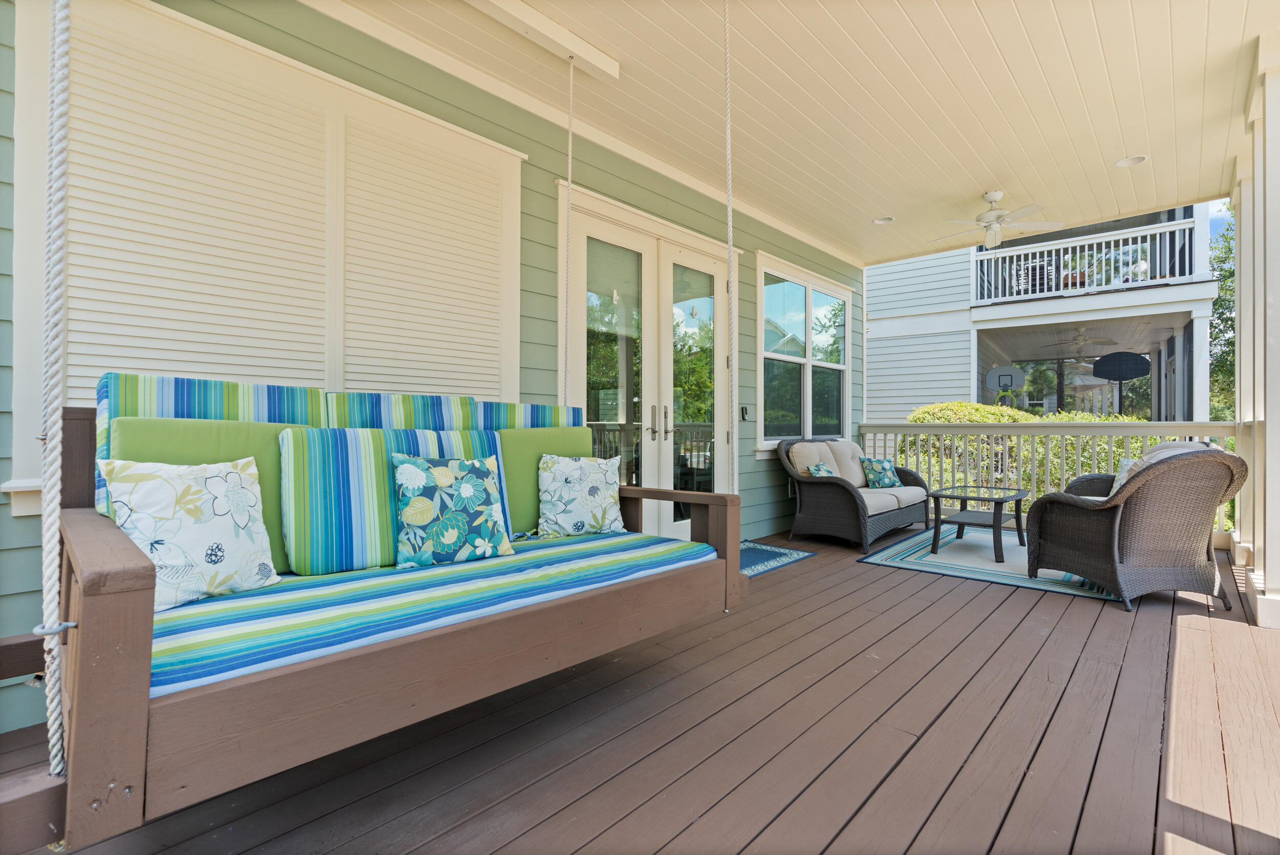 694 Flatwoods Forest Loop Santa Rosa Beach, FL 32459 - Photo 3 of 50 a balcony with furniture and a potted plant