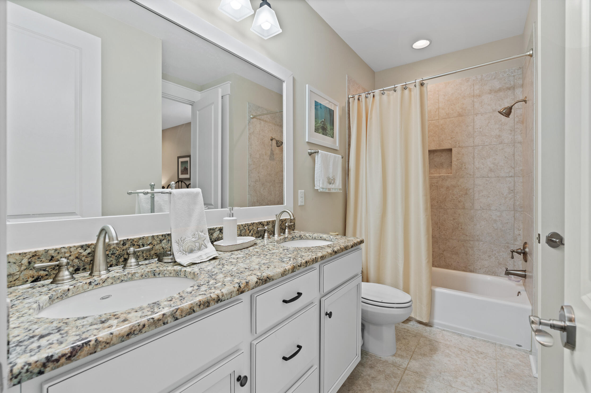 694 Flatwoods Forest Loop Santa Rosa Beach, FL 32459 - Photo 32 of 50 a bathroom with a granite countertop sink toilet and shower