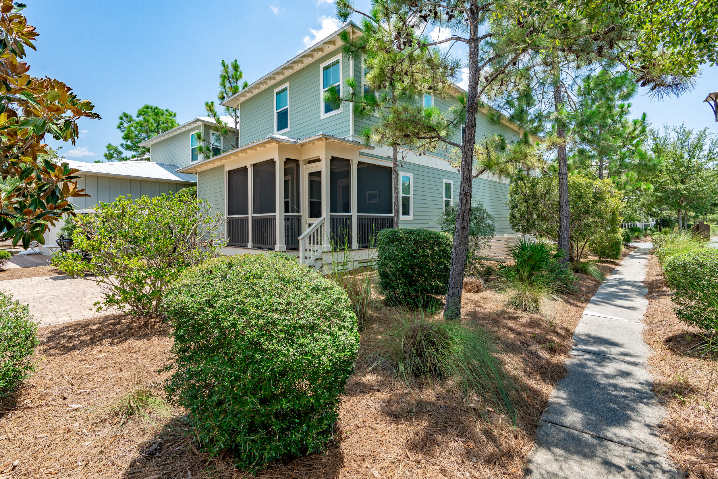 694 Flatwoods Forest Loop Santa Rosa Beach, FL 32459 - Photo 36 of 50 a front view of a house with garden