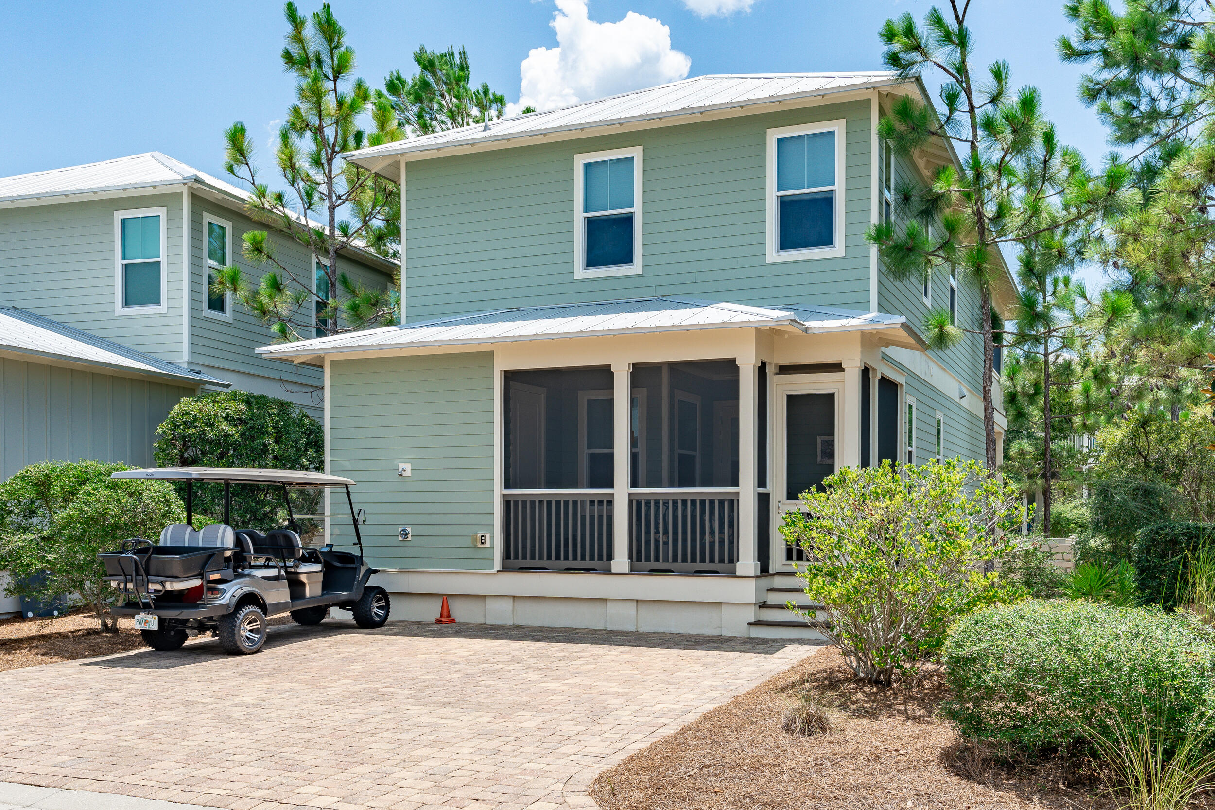 694 Flatwoods Forest Loop Santa Rosa Beach, FL 32459 - Photo 37 of 50 a view of a car park in front of house