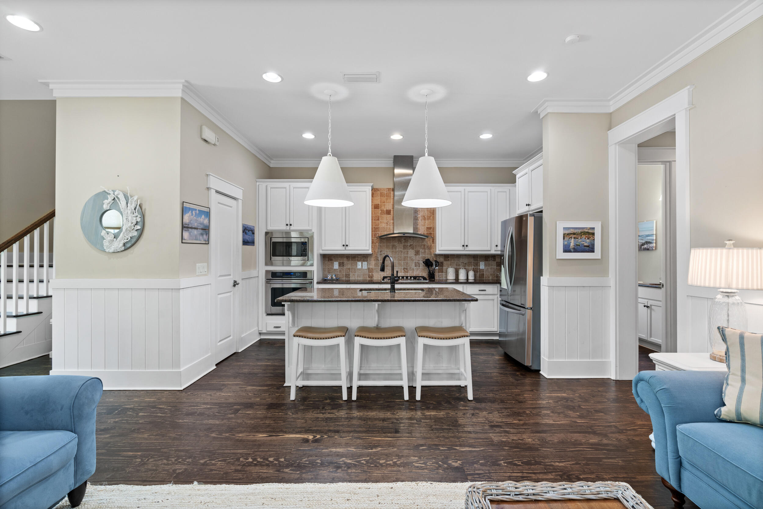 694 Flatwoods Forest Loop Santa Rosa Beach, FL 32459 - Photo 9 of 50 a living room with stainless steel appliances furniture a rug kitchen view and a fireplace