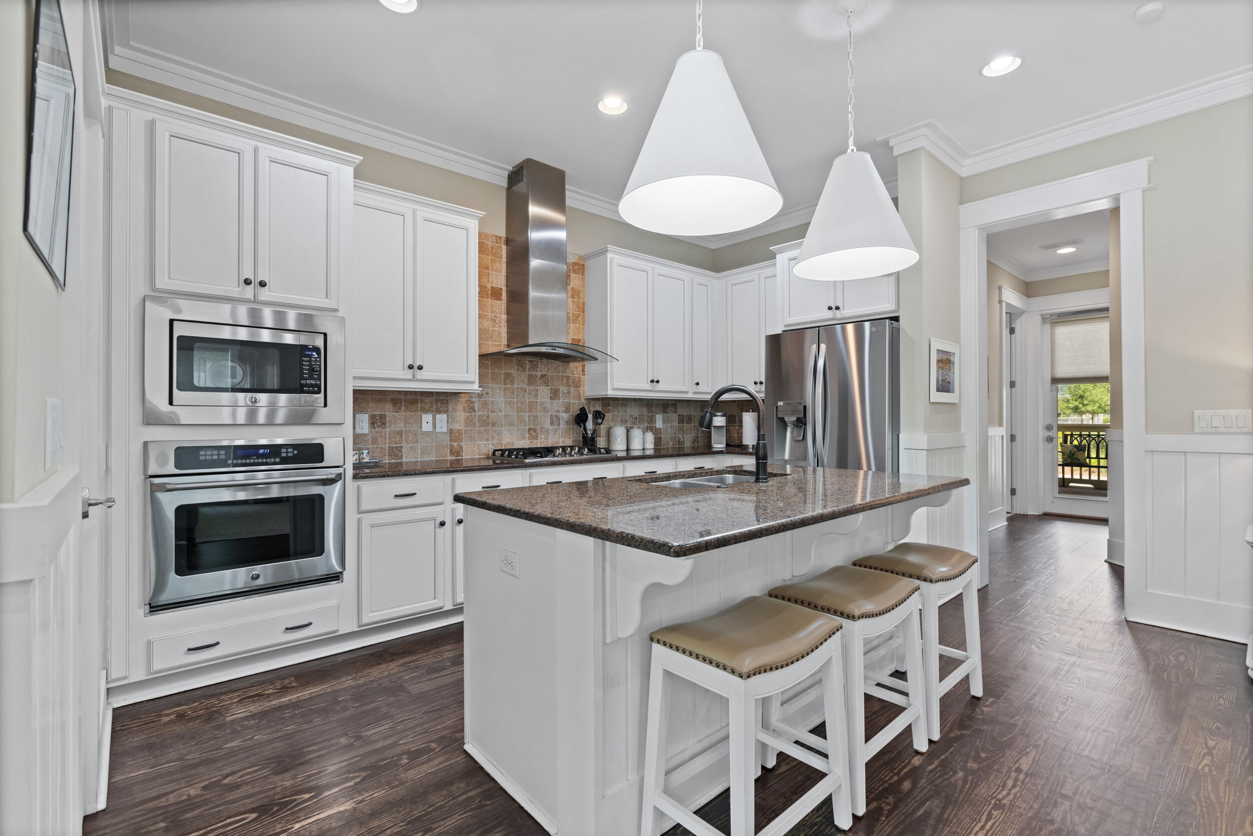 694 Flatwoods Forest Loop Santa Rosa Beach, FL 32459 - Photo 10 of 50 a kitchen with granite countertop a stove a sink and a refrigerator