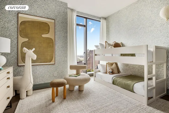 a bedroom with a large bed and a window