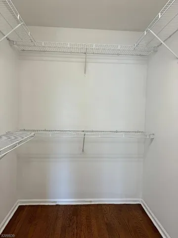 a view of an empty walk in closet