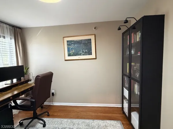 a workspace with furniture and a window