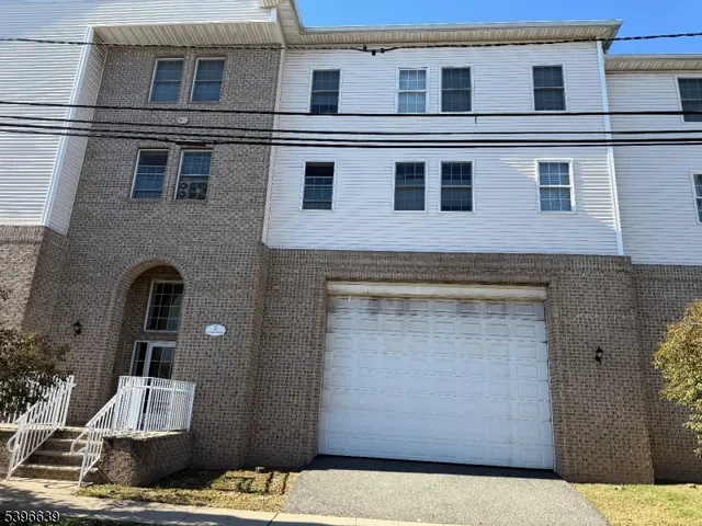 a front view of a house with swimming pool