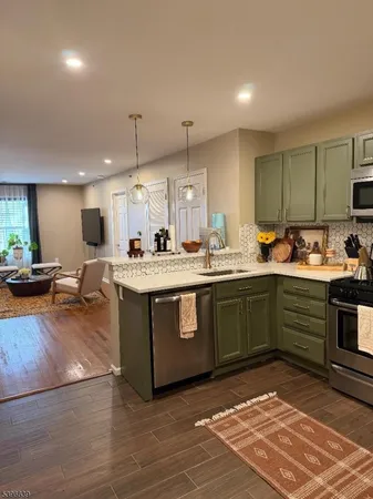 a kitchen with a sink cabinets and window