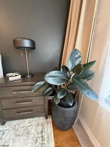 a bedroom with a bed and a chair